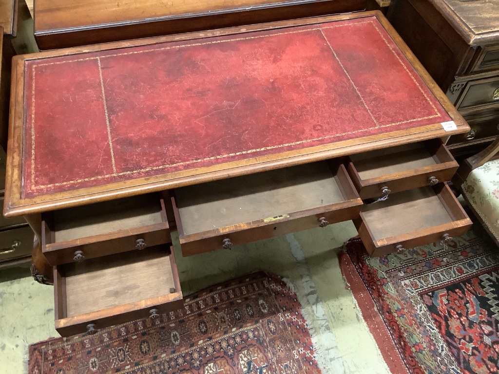 A Victorian walnut kneehole rosewood desk by Wilkinson & Son, Old Bond Street, stamped 11761, width 134cm, depth 64cm, height 75cm